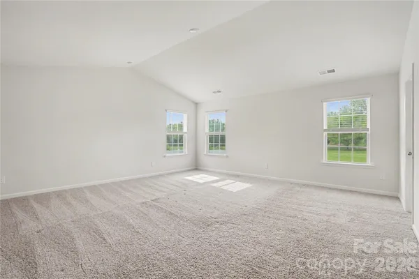 a view of empty room with windows