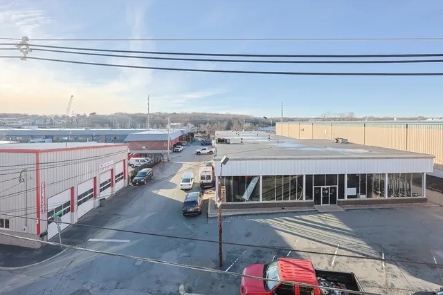 a front view of a building with parking space