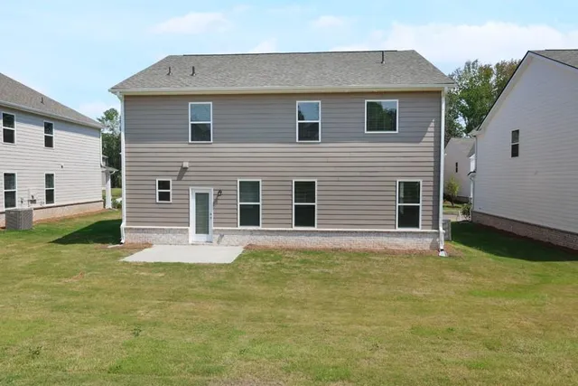 a house that has a big yard in front of it
