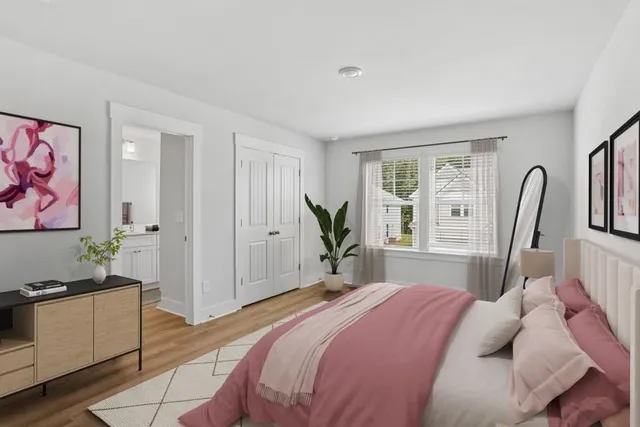 a bedroom with a bed and a dresser