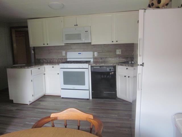 11578 Freeport Road Durand, IL 61024 - Photo 3 of 27 a kitchen with stainless steel appliances granite countertop a stove a sink and a refrigerator