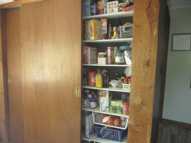 11578 Freeport Road Durand, IL 61024 - Photo 4 of 27 a shelf with books and knick knacks on it