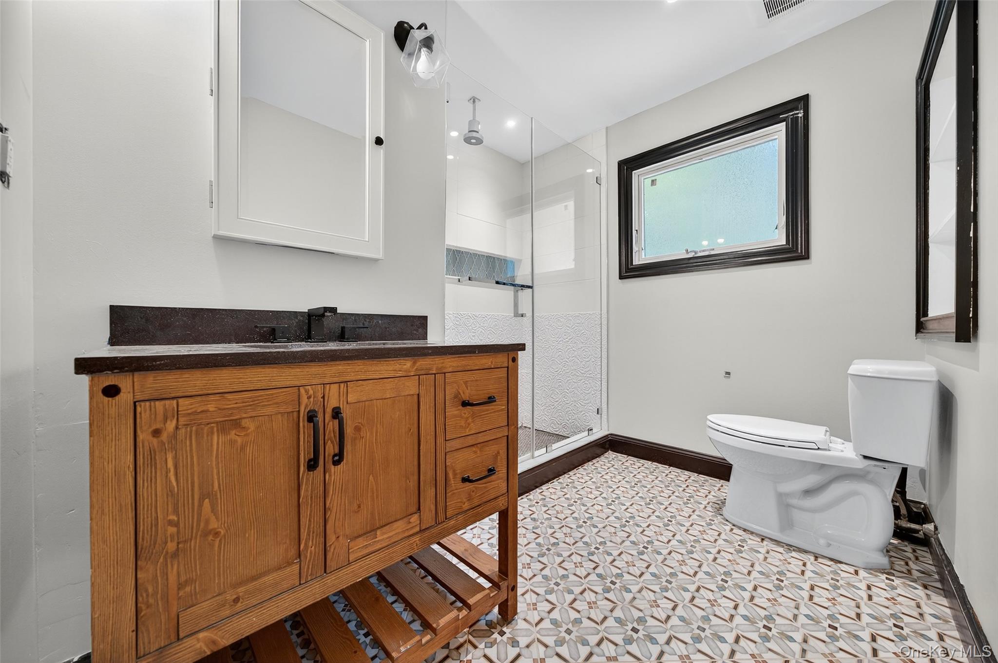 65 Hawxhurst Road Monroe, NY 10950 - Photo 26 of 35 Full bath with vanity and a walk in shower