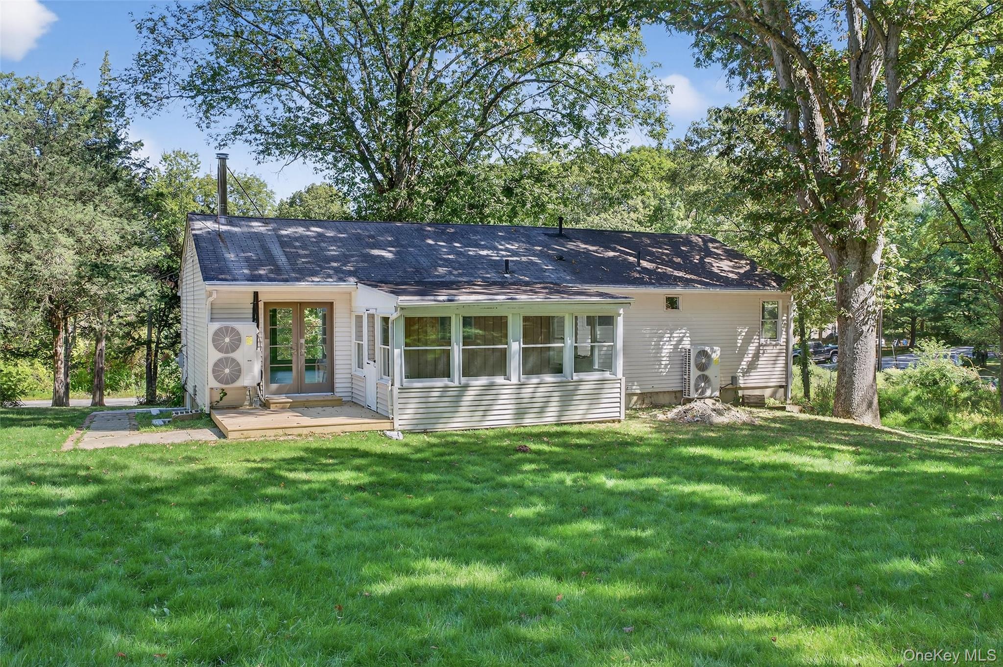65 Hawxhurst Road Monroe, NY 10950 - Photo 32 of 35 Rear view of house with a lawn and french doors