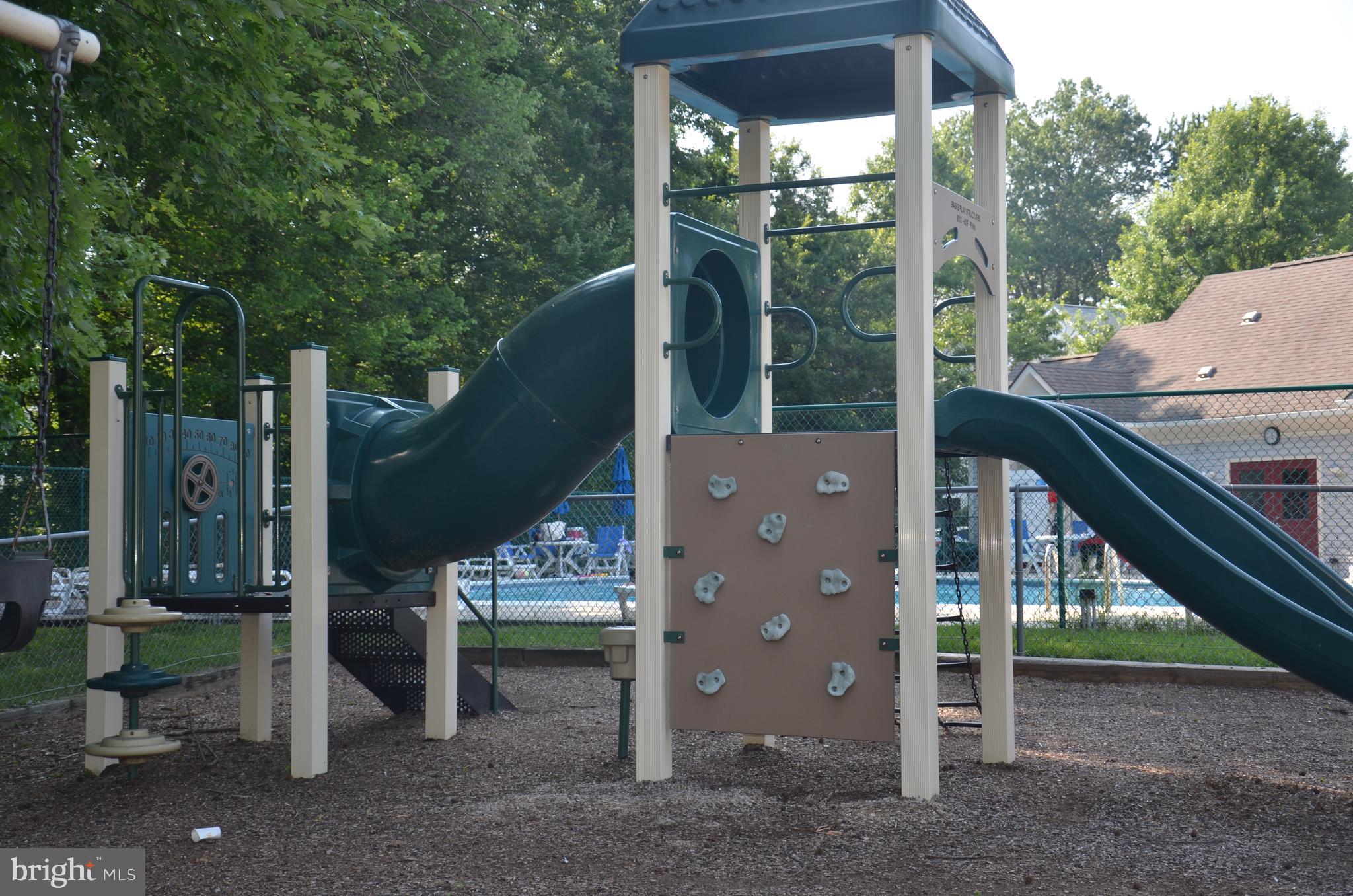 7522 Snowpea Court, Unit 24 Alexandria, VA 22306 - Photo 18 of 19 a house view with a sitting space and garden