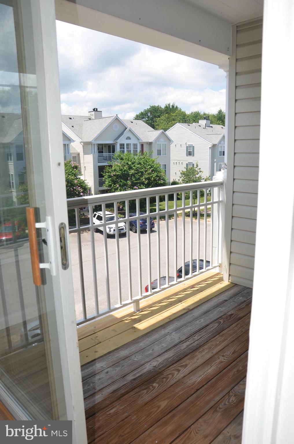 7522 Snowpea Court, Unit 24 Alexandria, VA 22306 - Photo 5 of 19 a view of a balcony with wooden floor