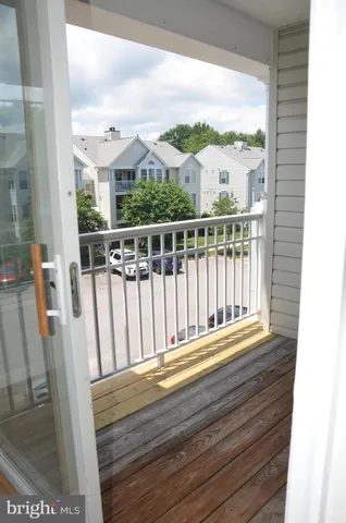 a view of a balcony with wooden floor