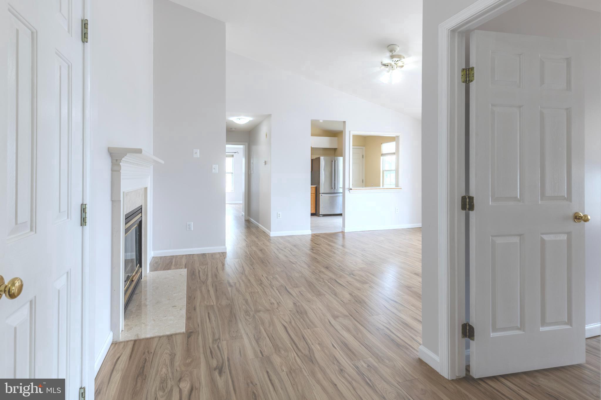 7522 Snowpea Court, Unit 24 Alexandria, VA 22306 - Photo 8 of 19 a view of livingroom with hardwood floor and hallway