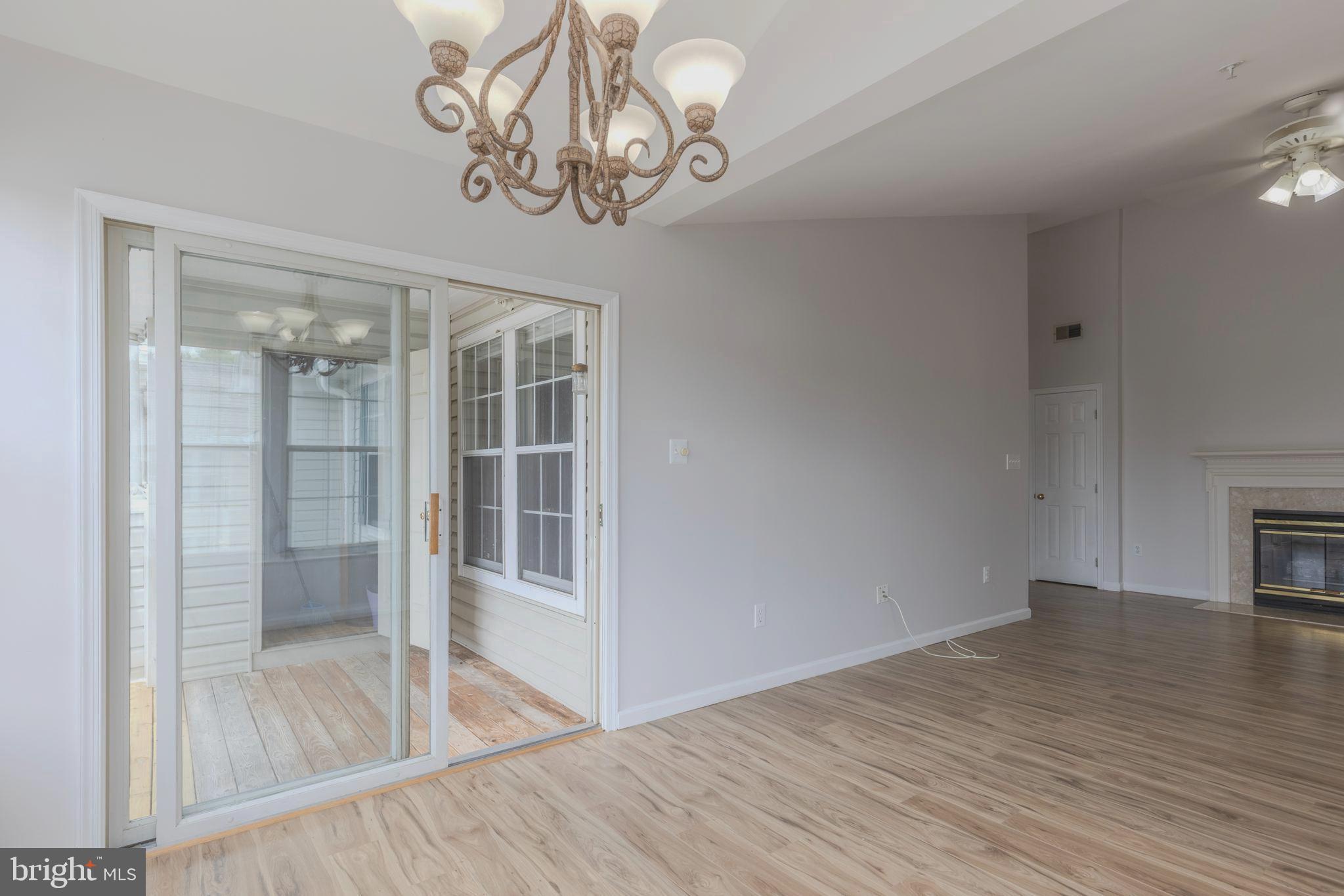 7522 Snowpea Court, Unit 24 Alexandria, VA 22306 - Photo 10 of 19 wooden floor in an empty room with a window