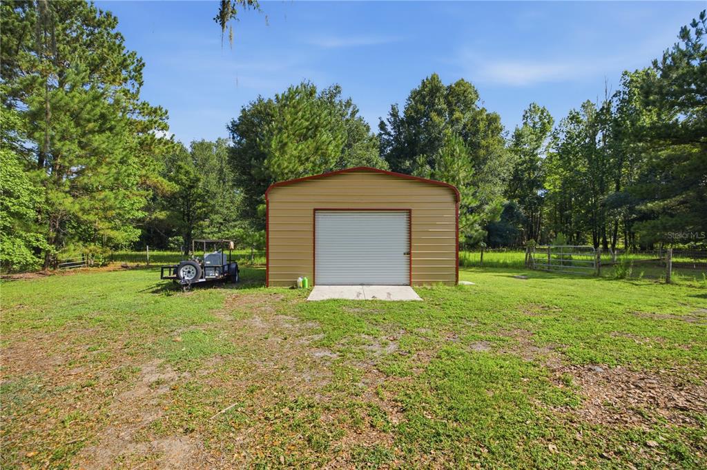 17900 Northwest 120th Avenue Road Reddick, FL 32686 - Photo 19 of 45 a house view with a garden space