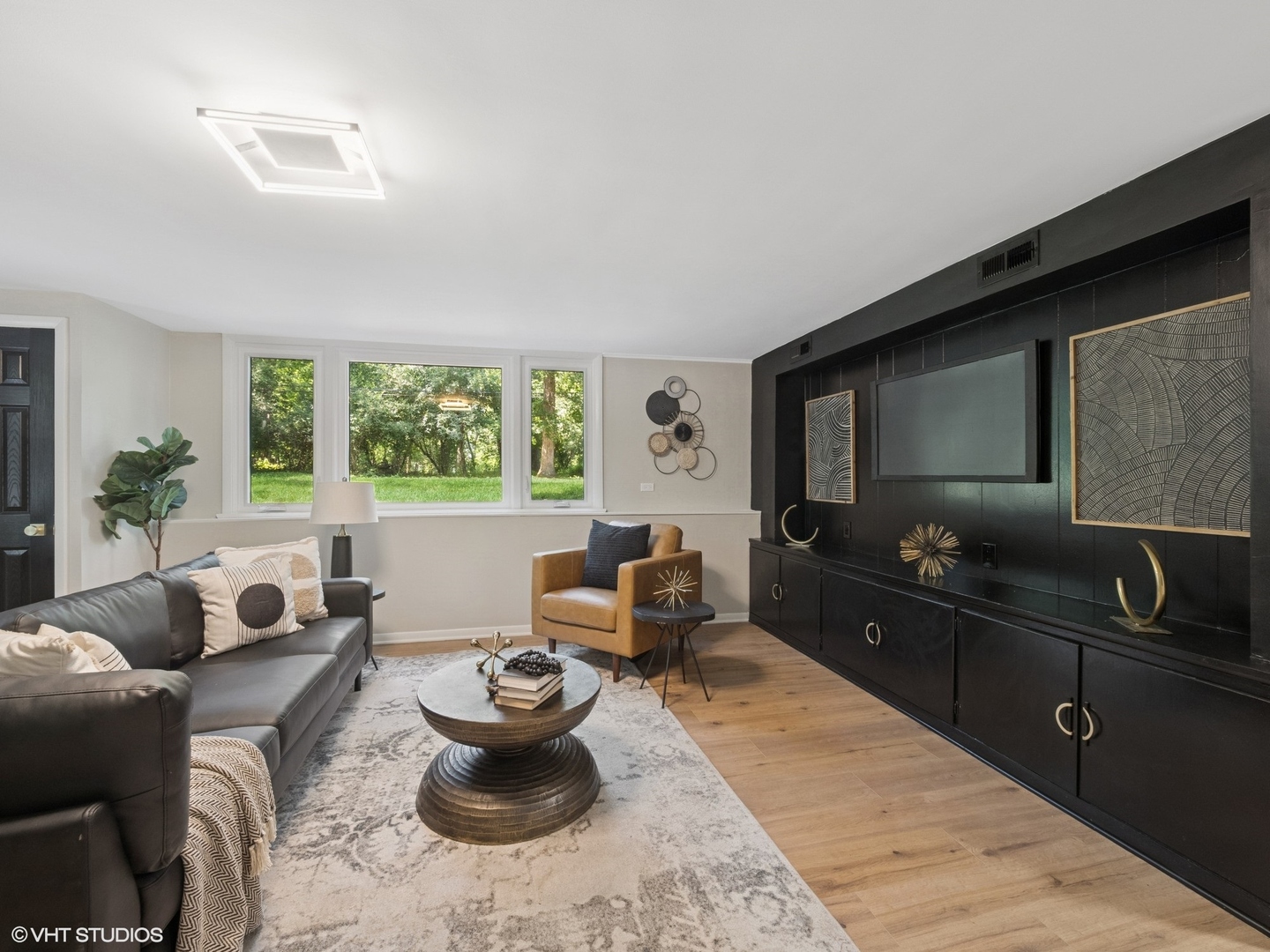 600 Eton Drive North Barrington, IL 60010 - Photo 15 of 37 a living room with furniture a large window and a flat screen tv