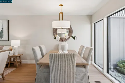 a dining room with furniture and window