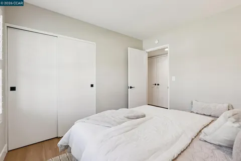 a bedroom with a bed and a shower