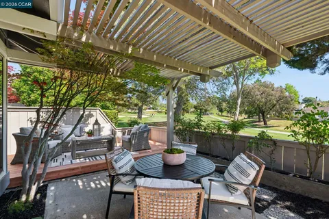 a view of a chairs and table in the patio