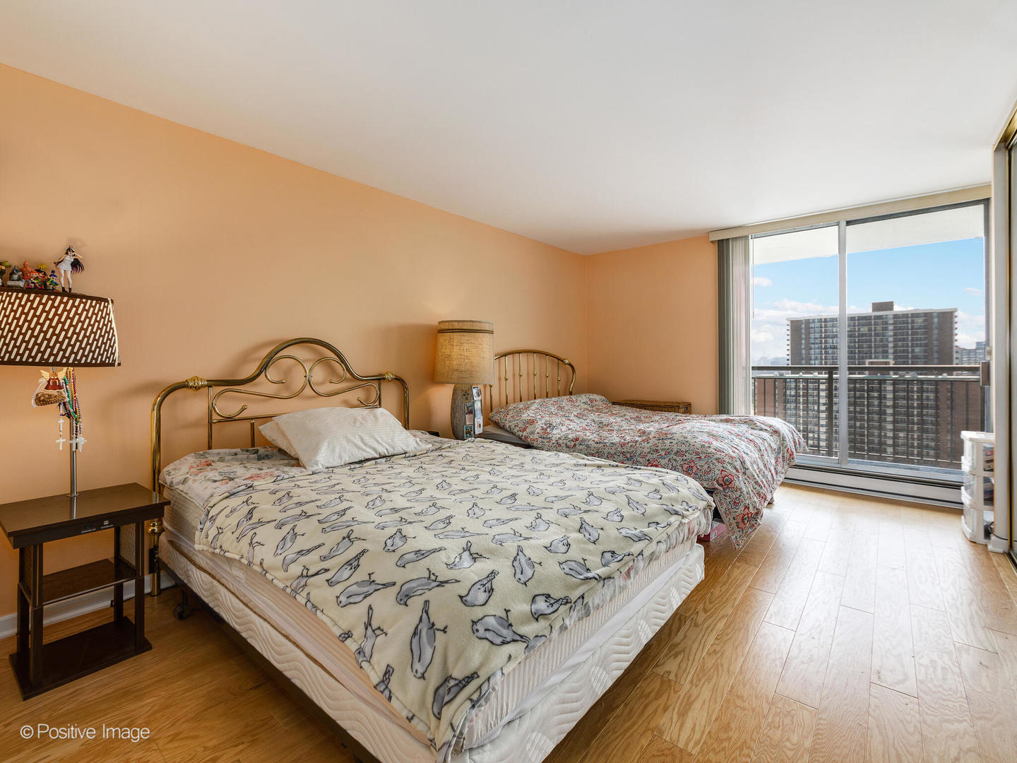 6007 North Sheridan Road, Unit 17G Chicago, IL 60660 - Photo 12 of 18 a bedroom with a bed and wooden floor