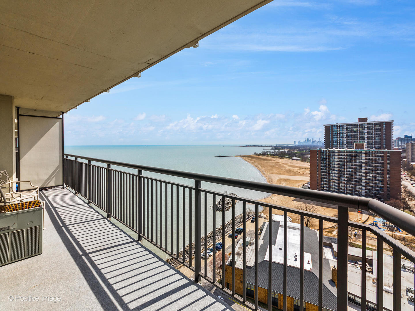 6007 North Sheridan Road, Unit 17G Chicago, IL 60660 - Photo 16 of 18 a balcony with wooden floor and city view