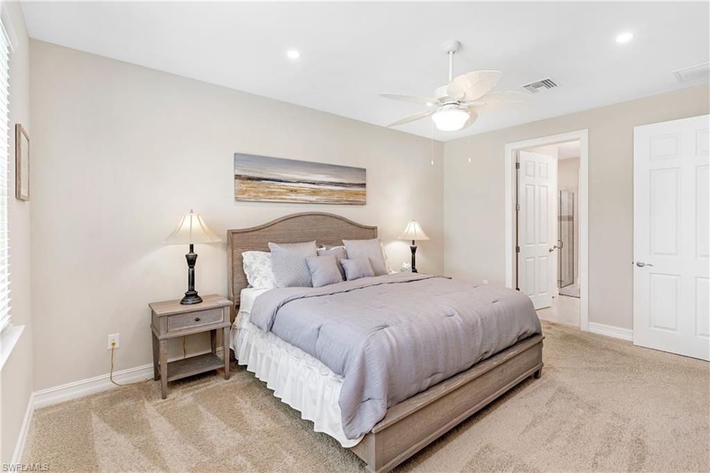 14488 Stillwater Way Naples, FL 34114 - Photo 17 of 36 Bedroom featuring light carpet, recessed lighting, ceiling fan, and ensuite bath