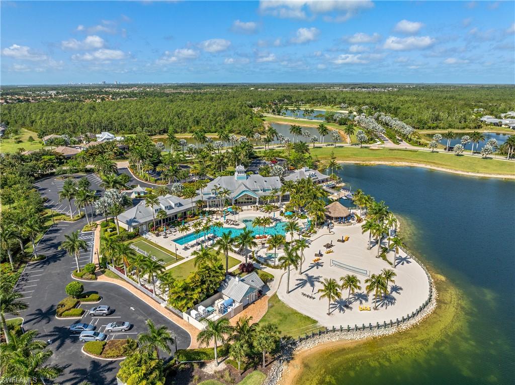 14488 Stillwater Way Naples, FL 34114 - Photo 30 of 36 Bird's eye view of a heavily wooded area and a nearby body of water