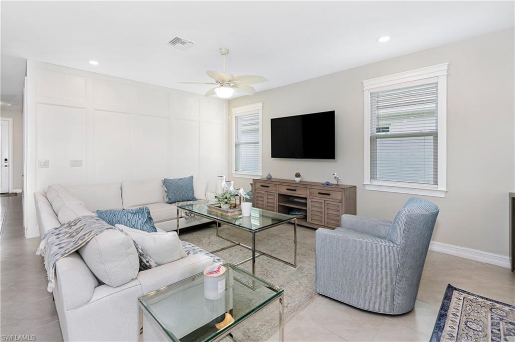 14488 Stillwater Way Naples, FL 34114 - Photo 3 of 36 Living room with a ceiling fan, recessed lighting, and light tile patterned flooring