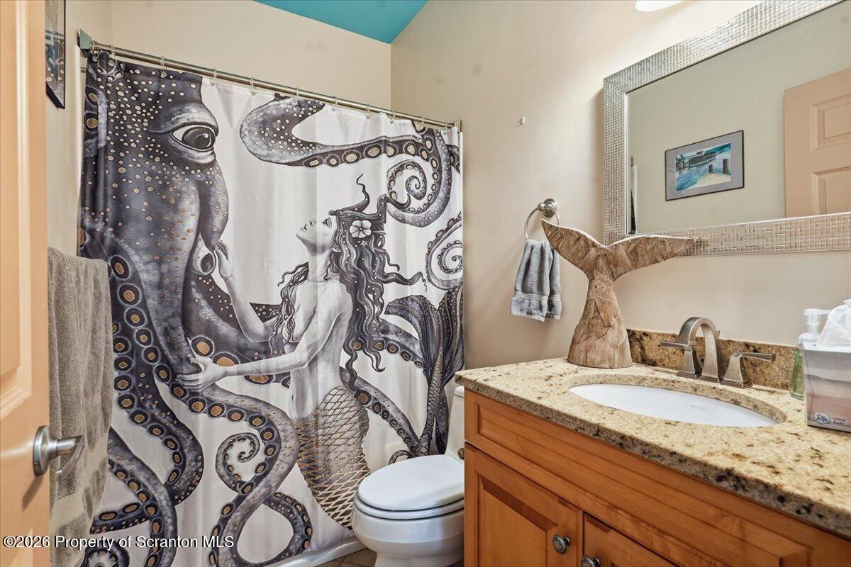 99 Hilltop Road Waverly, PA 18471 - Photo 21 of 41 a bathroom with a granite countertop sink and a mirror