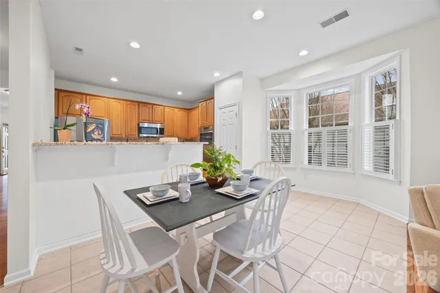 an empty room with a window and a ceiling fan