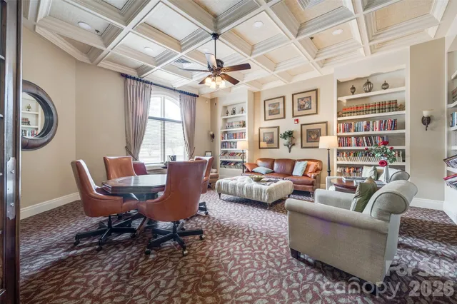 a living room with furniture a table and chairs