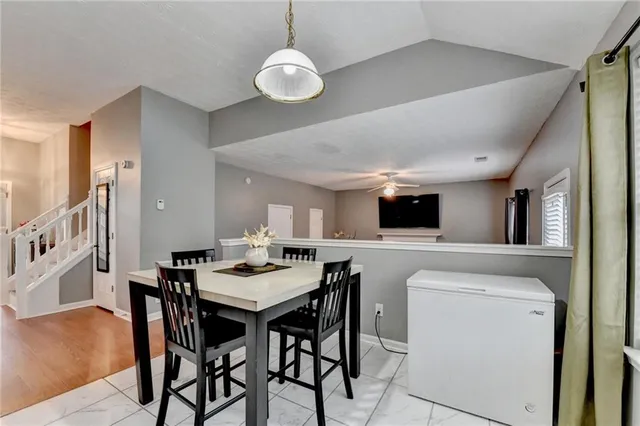 a kitchen that has a cabinets and a table in it