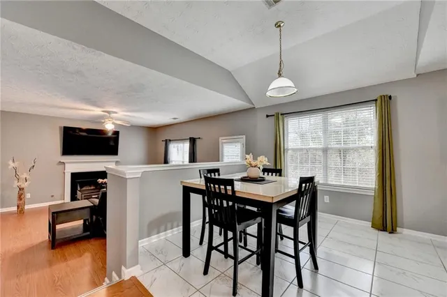 a view of a livingroom with furniture and a window