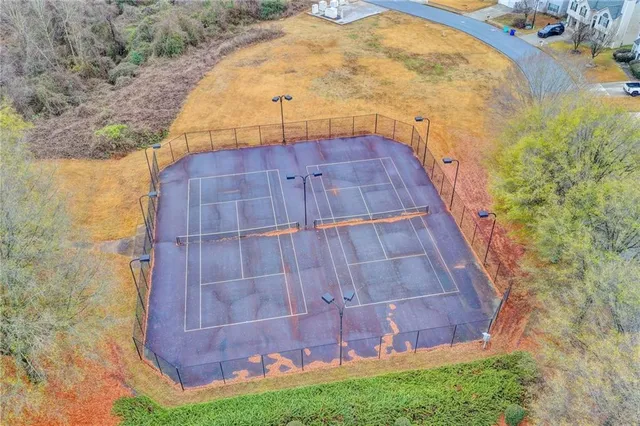 a view of a tall building with a small yard