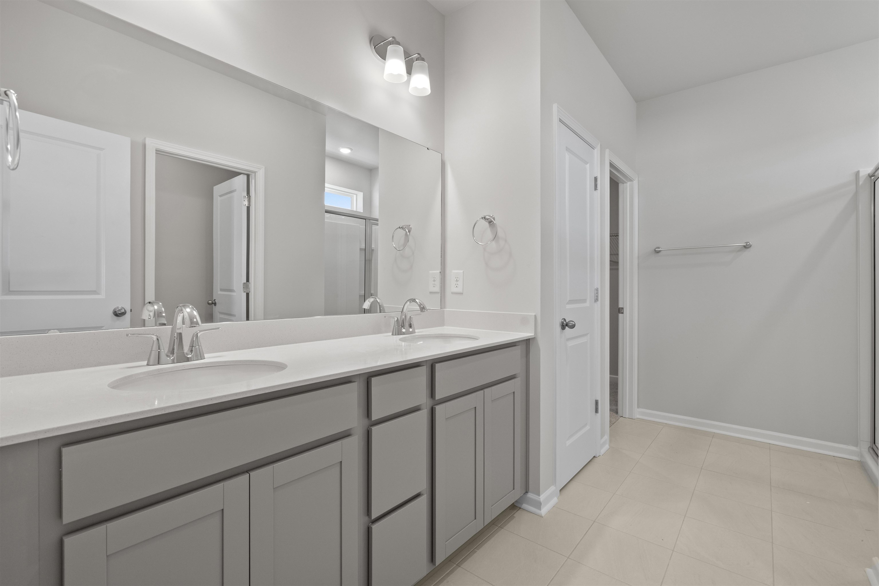 2491 Campton Loop Conway, SC 29527 - Photo 17 of 38 Full bath with double vanity, a stall shower, and light tile patterned floors