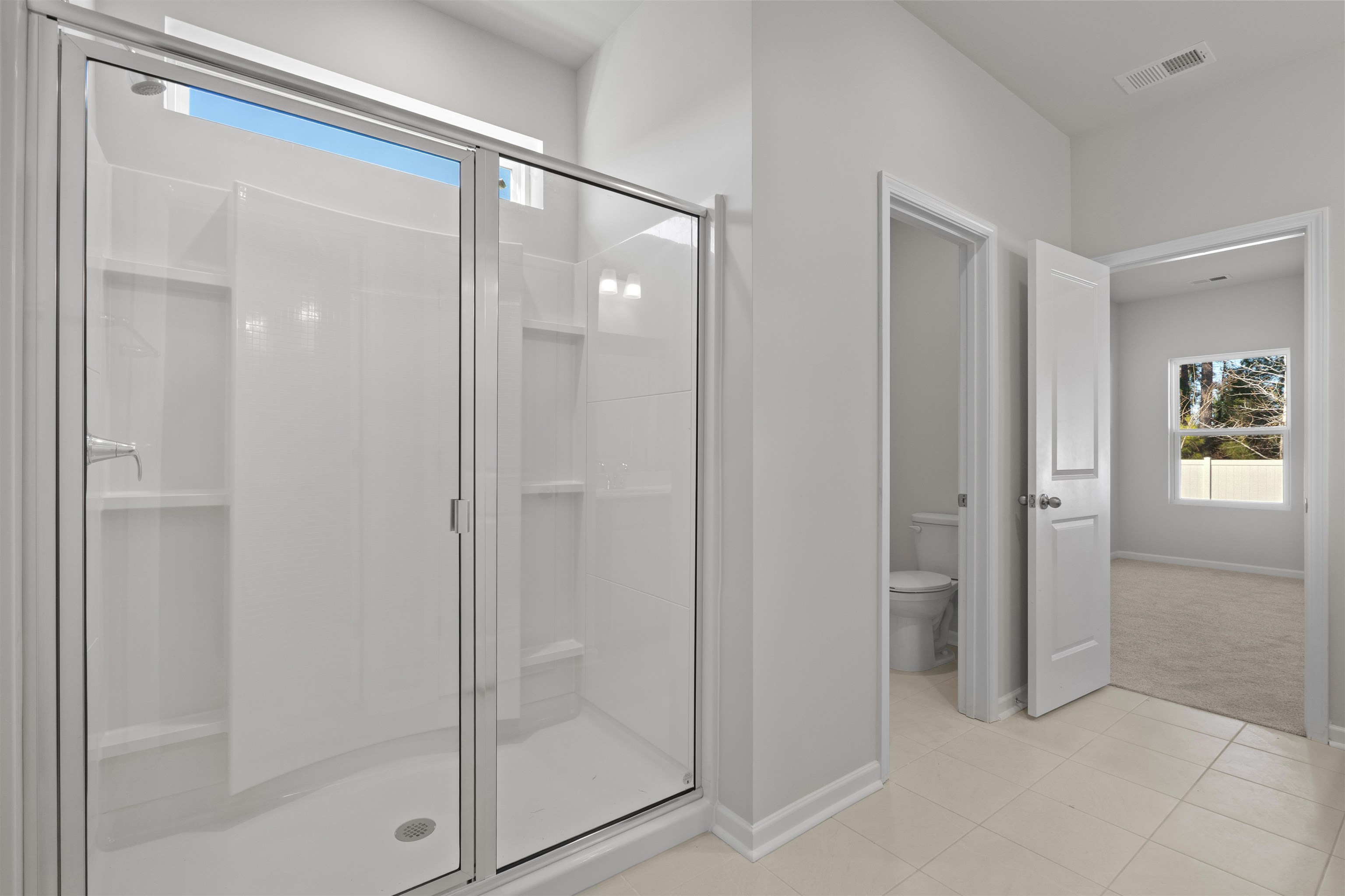 2491 Campton Loop Conway, SC 29527 - Photo 18 of 38 Full bathroom with plenty of natural light, a shower stall, and light tile patterned flooring