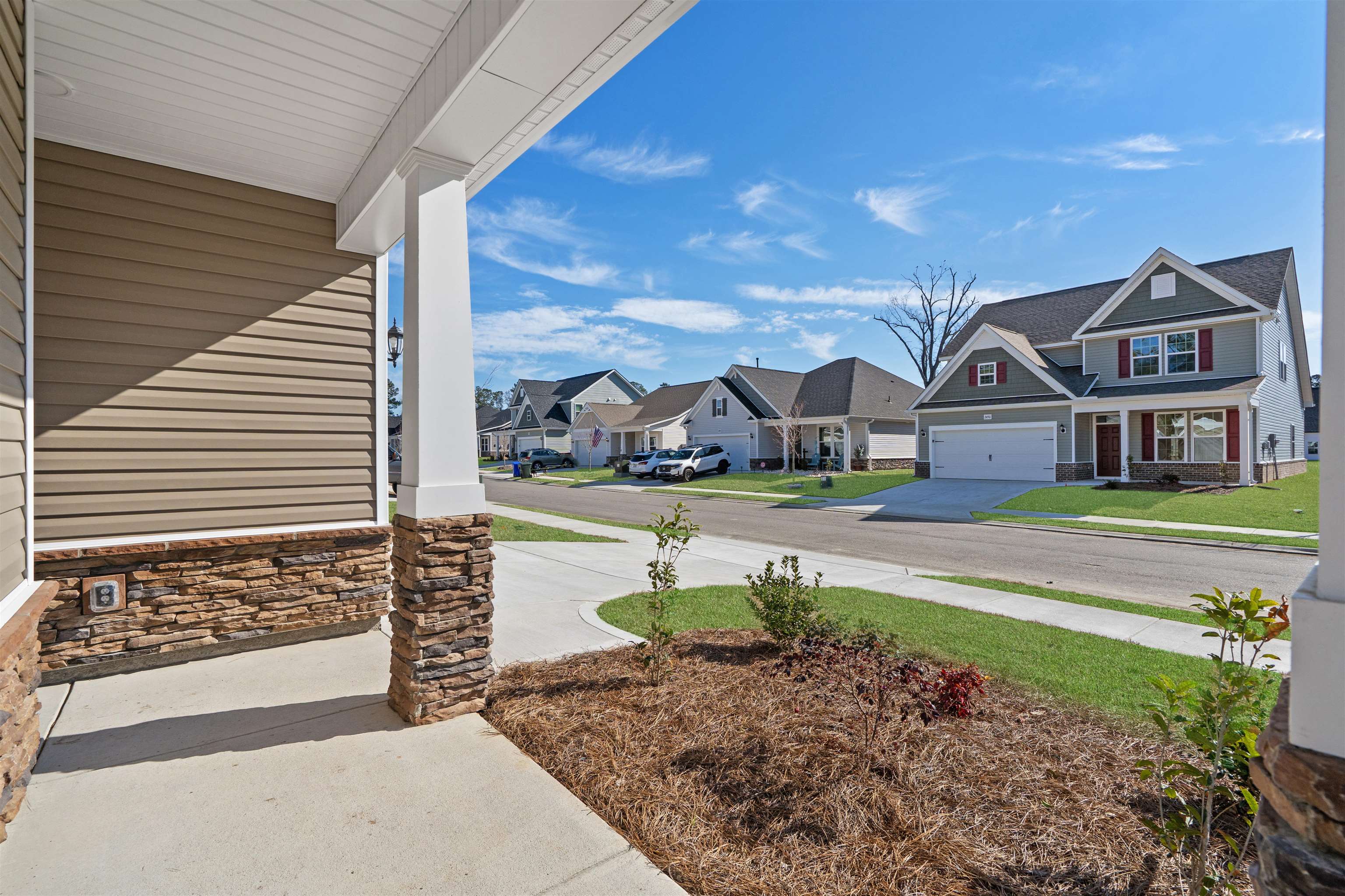 2491 Campton Loop Conway, SC 29527 - Photo 3 of 38 View of yard with covered porch and a residential view
