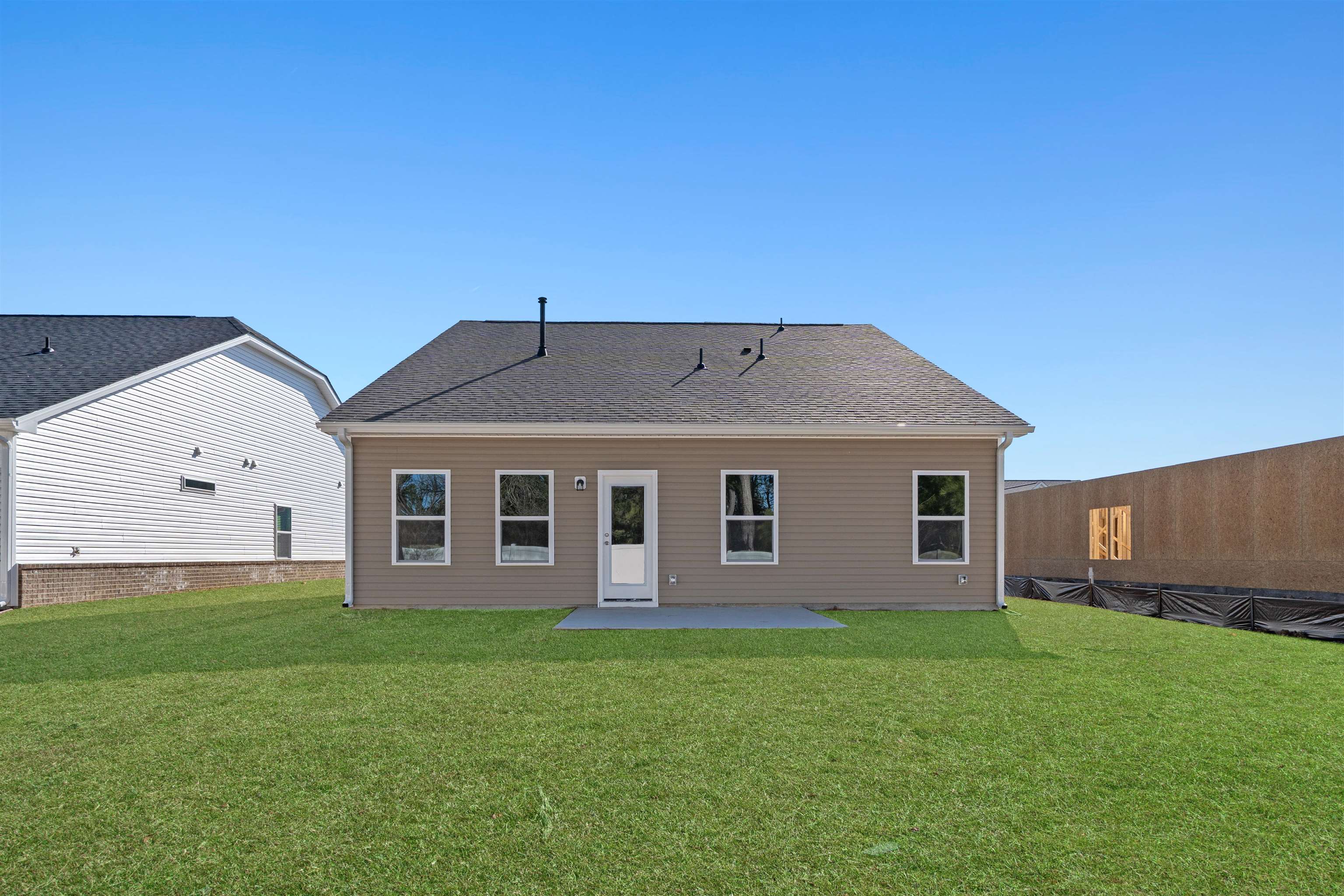 2491 Campton Loop Conway, SC 29527 - Photo 30 of 38 Rear view of house with a patio area, a lawn, and roof with shingles