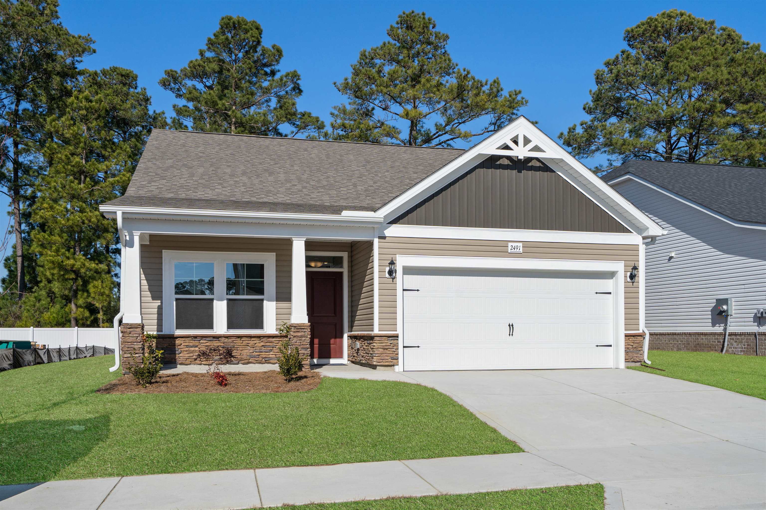 2491 Campton Loop Conway, SC 29527 - Photo 32 of 38 Craftsman house with a porch, a garage, concrete driveway, and stone siding