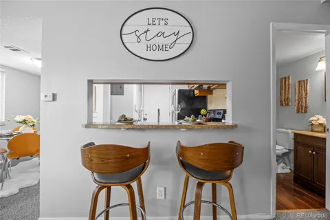 a view of a room with furniture and a chandelier