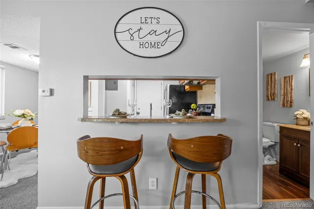 a view of a room with furniture and a chandelier