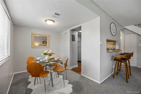 a dining room with furniture and window