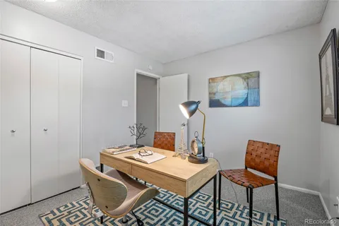 a view of a workspace with furniture