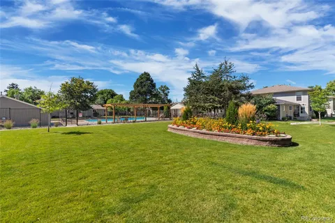 a view of a fountain in front of the house