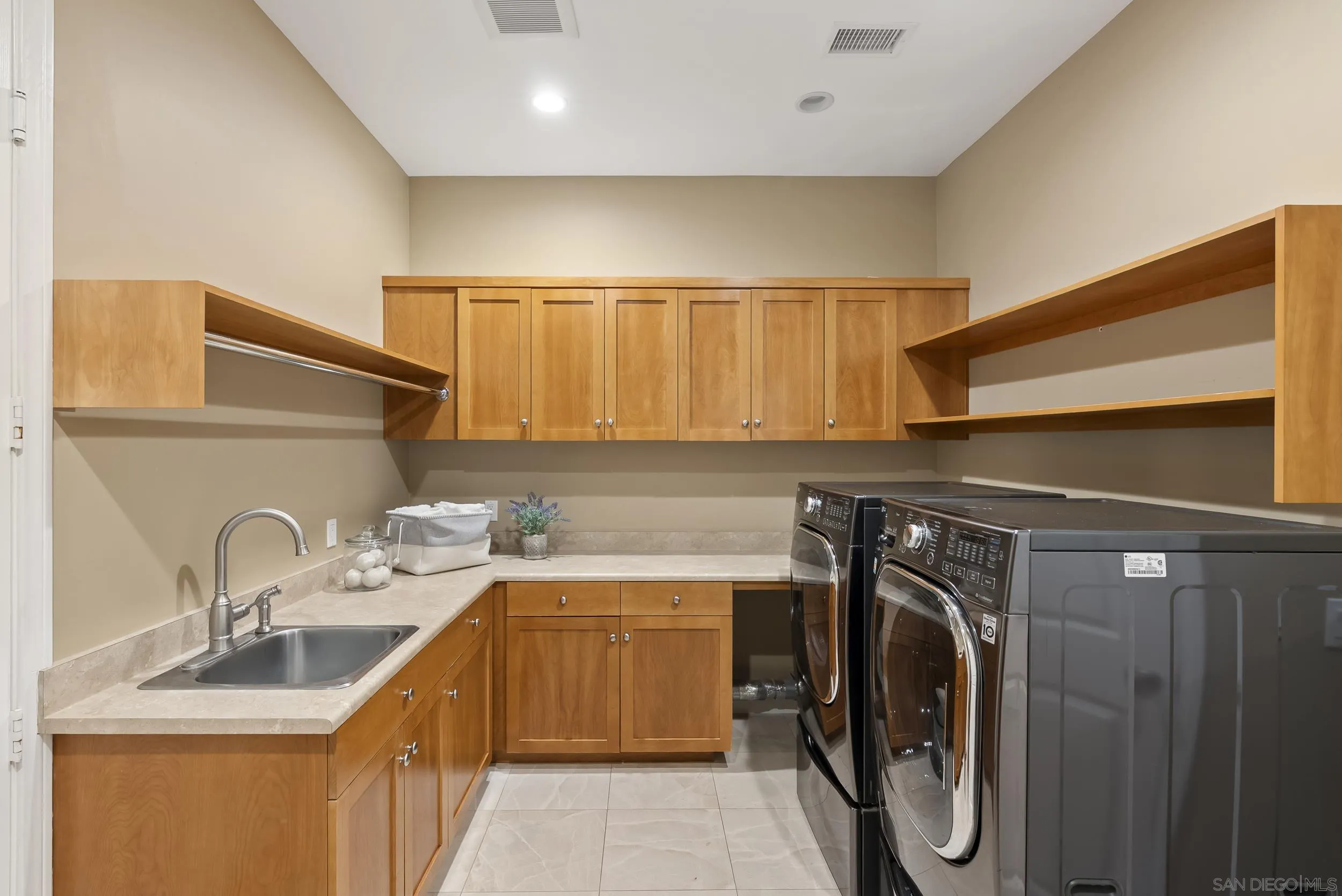 14998 Budwin Lane Poway, CA 92064 - Photo 35 of 44 a utility room with a sink a washer and dryer