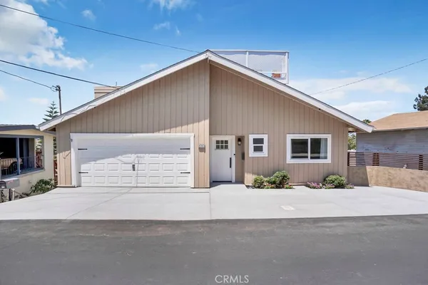 a front view of a house with a outdoor space