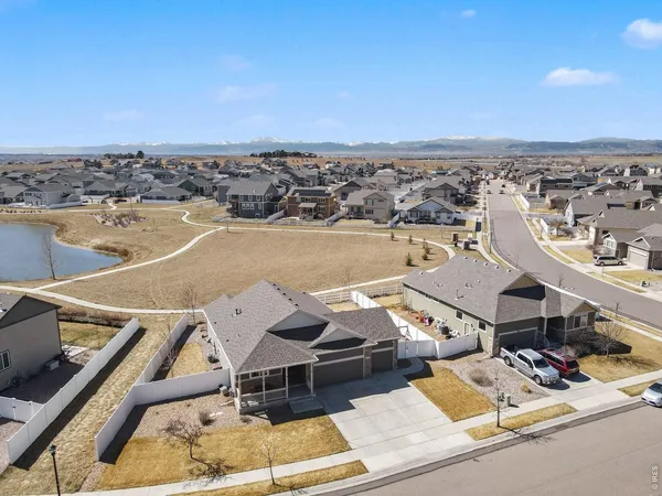 an aerial view of a house with ocean view
