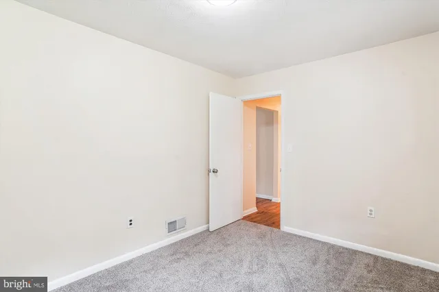 a bathroom with a sink a toilet and a window