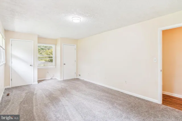 a living room with furniture and a chair