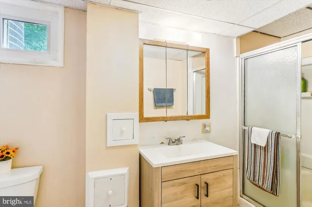 a picture of a book and a white wall