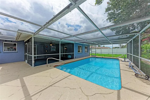 a view of a backyard with seating area