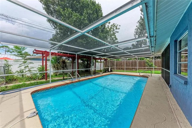 a view of swimming pool with a patio