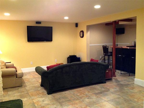 115 A Lakeshore Road Boxford, MA 01921 - Photo 24 of 29 a living room with furniture and a flat screen tv