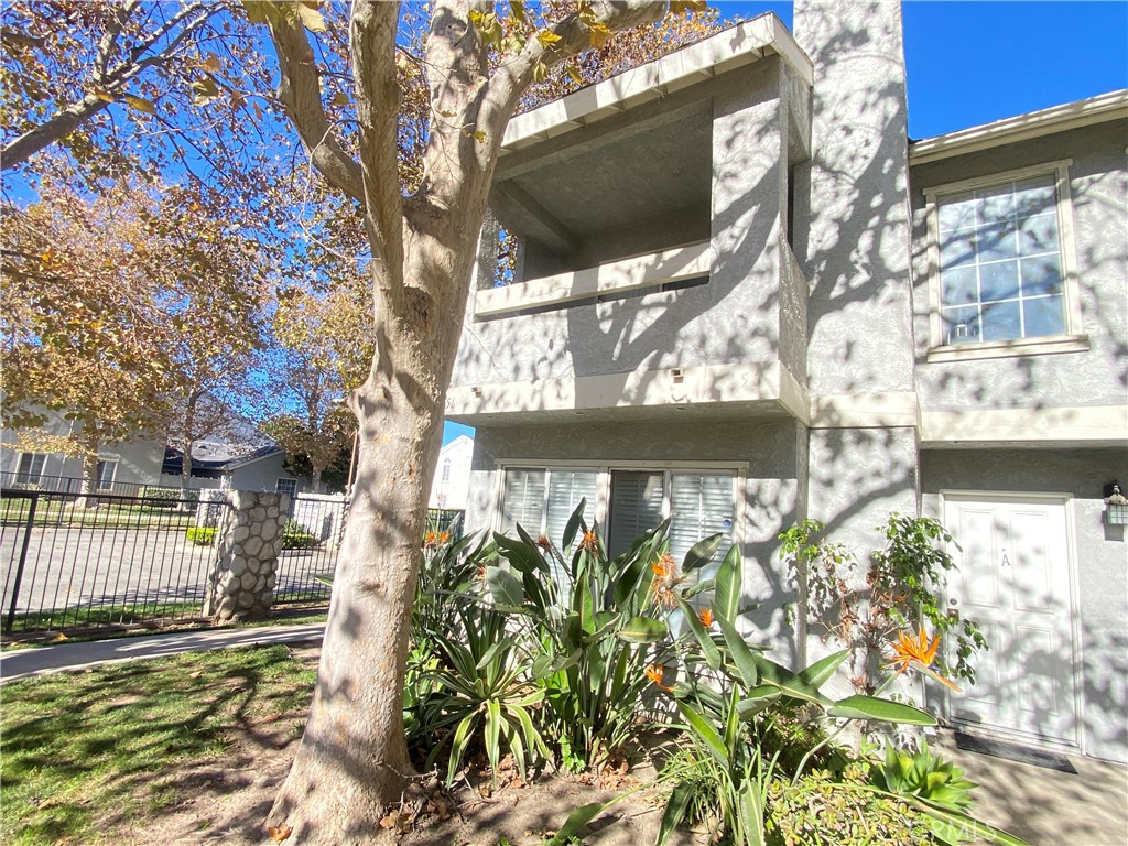 156 West Walnut Avenue, Unit A Rialto, CA 92376 - Photo 2 of 28 a view of a garden with a pathway