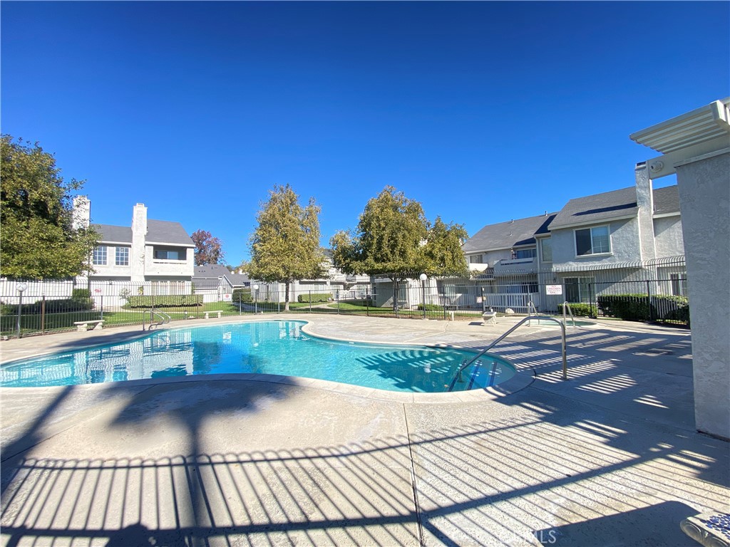 156 West Walnut Avenue, Unit A Rialto, CA 92376 - Photo 27 of 28 a view of swimming pool with outdoor seating and plants